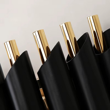 Black Gold Mamba Chandelier, luxurious modern chandelier, statement lighting for living room, dining room, and elegant home interiors.